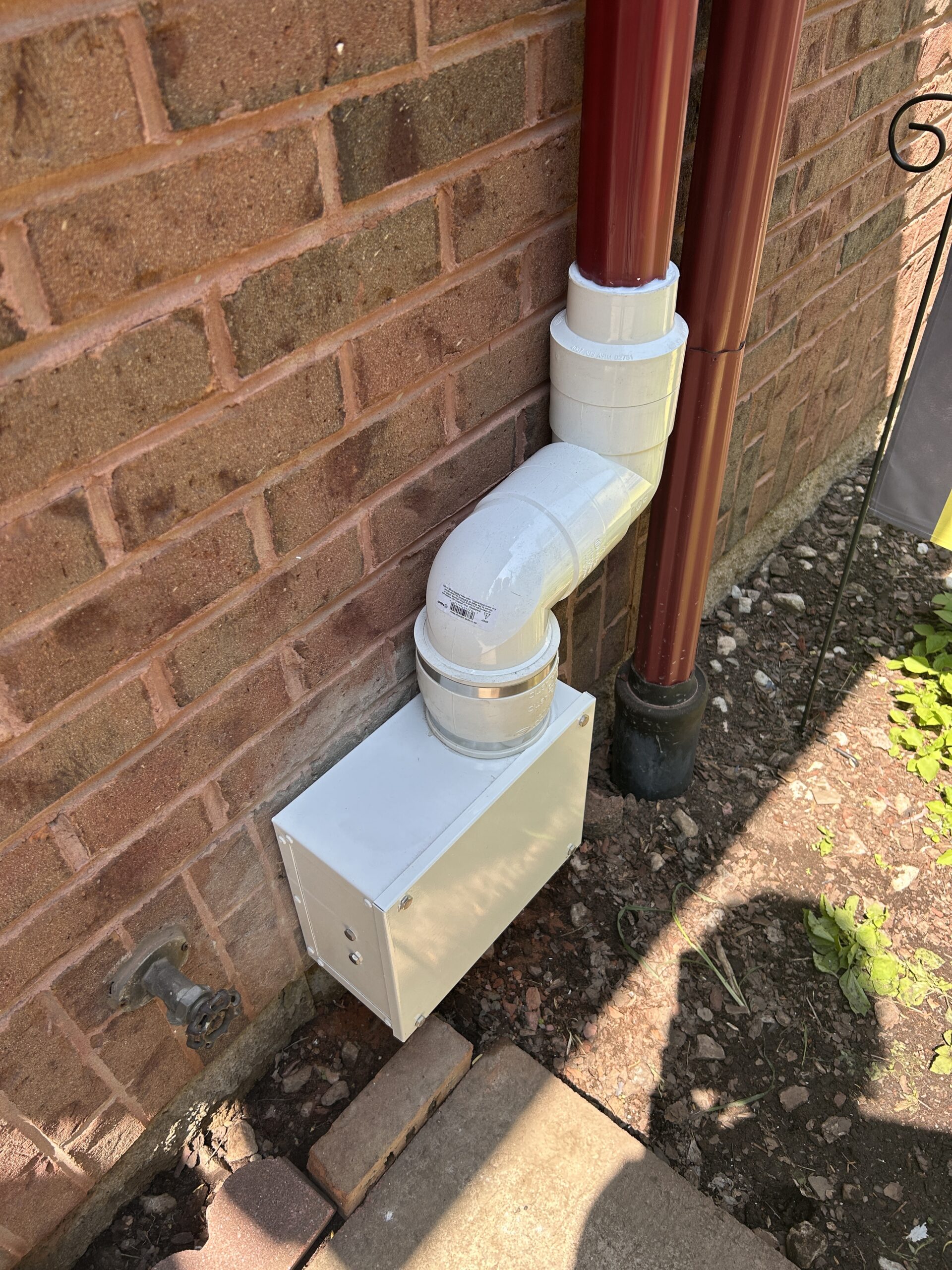 Exterior radon pipes & fan connections to new metal downspout