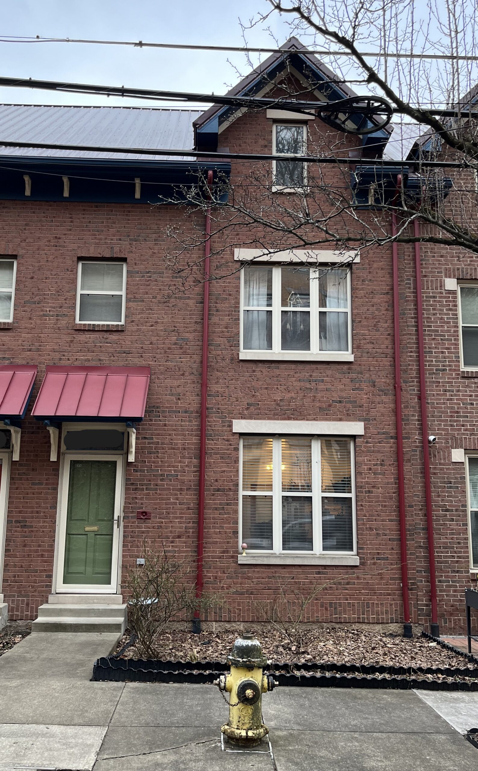 Photo of front exterior of a brick row house