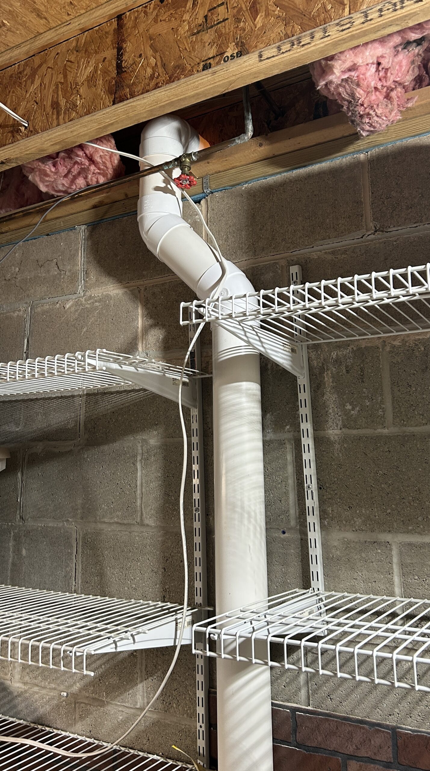 Photo of interior radon discharge pipes connected & sealed