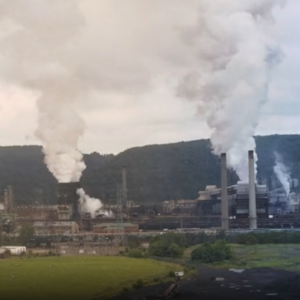 Factory smokestacks with clouds of pollution