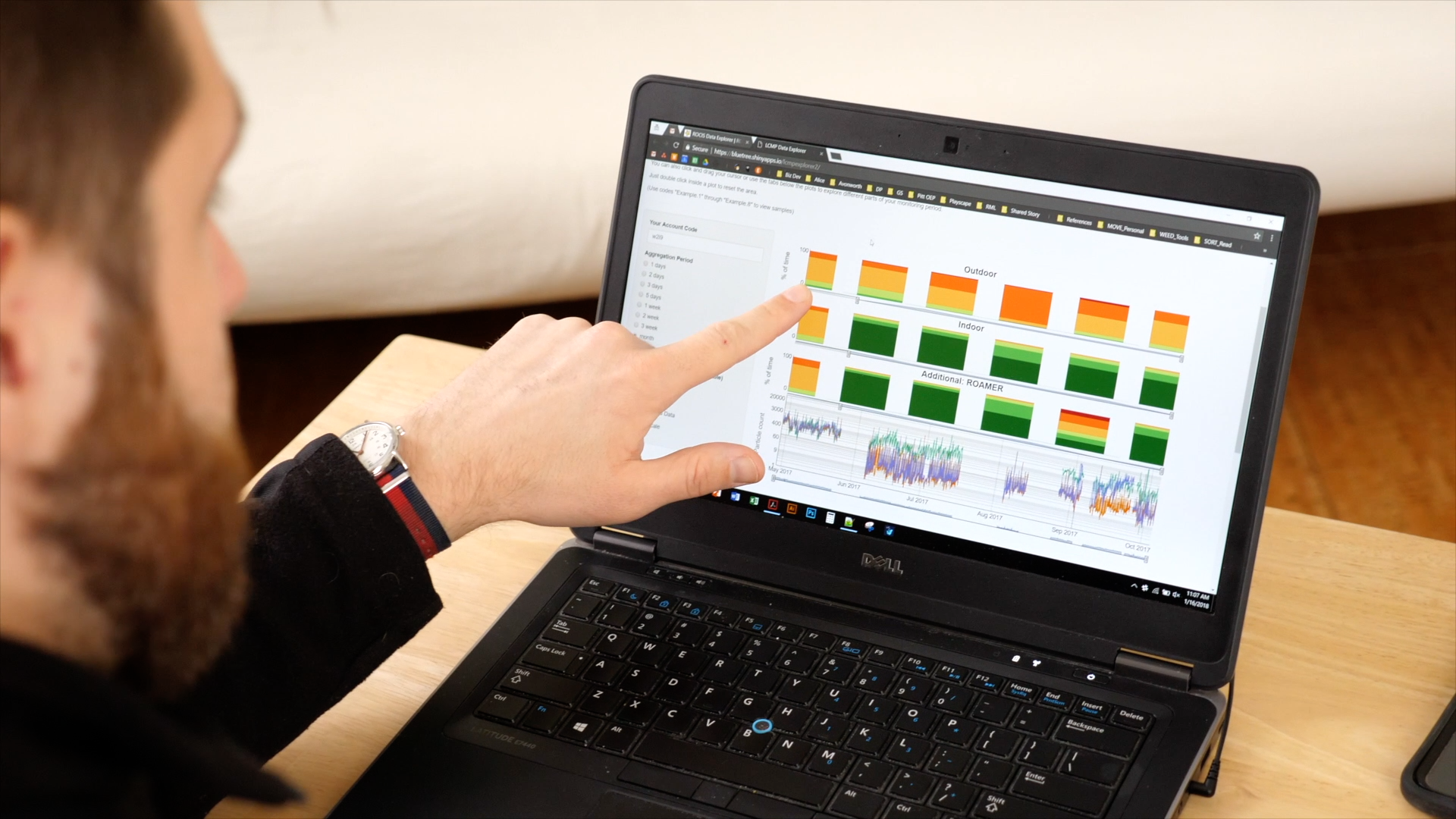 ROCIS team member with laptop showing air quality data