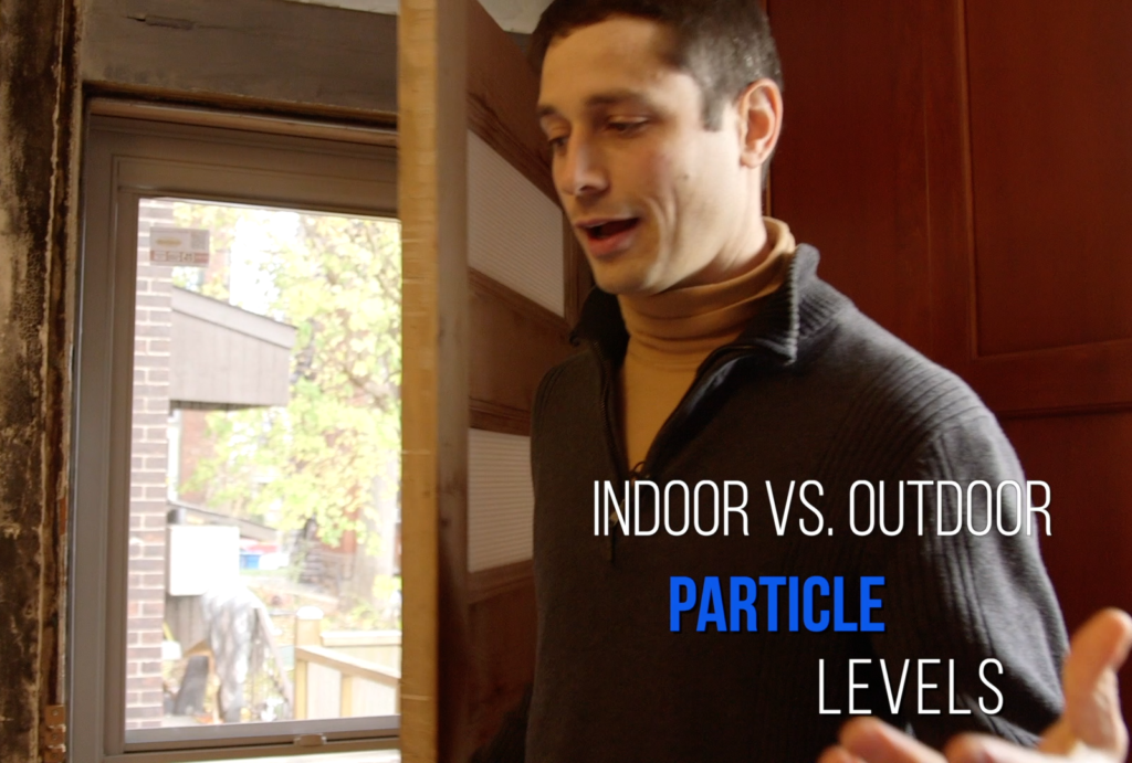 Andrew in his house with title Indoor vs Outdoor Particle Levels