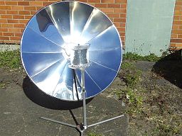 Sungril Solar Cooker showing a shiny round metal disc